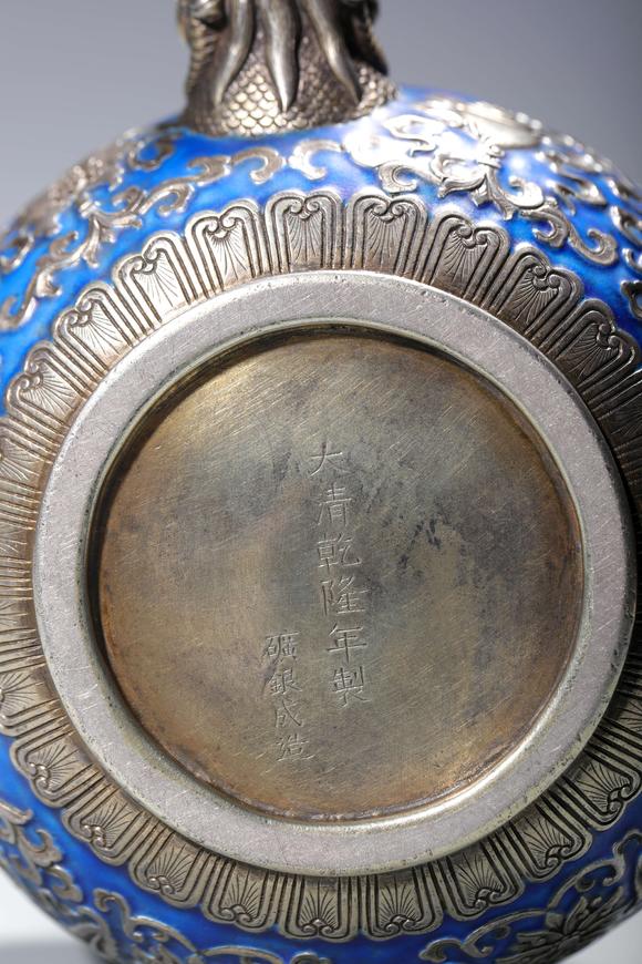 SEAVIEW AUCTIONS PTY LTDA Silver Enameled Wine Pot with Auspicious Buddhist Symbols and Dragon-Form Handle, China, 18th centuries