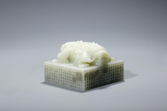 SEAVIEW AUCTIONS PTY LTDA Pale White Jade Imperial Square Seal with Double Dragon Knop and Imperial Inscription, China, 18th century