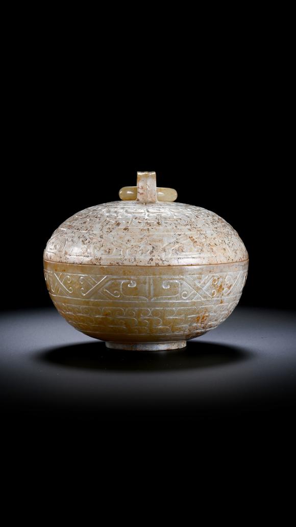 SEAVIEW AUCTIONS PTY LTDA Round White Jade Covered Box with Movable Ring Knob and Archaic Floral Scroll Carvings, 2nd BCE–3rd CE