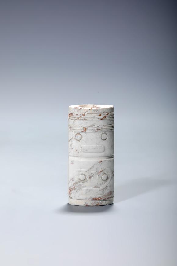 SEAVIEW AUCTIONS PTY LTDA Chicken-Bone Jade Cylindrical Cong Pendant with Double Mask Motifs, China, 3rd–2nd millennia BCE