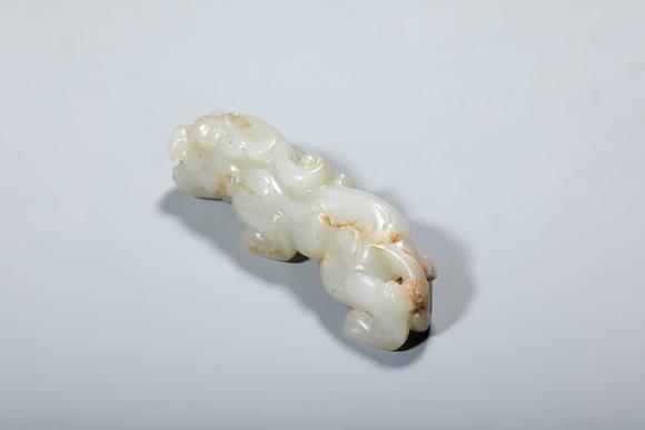 SEAVIEW AUCTIONS PTY LTDA Russet-Inclusion White Jade Recumbent Chilong Dragon, China, 2nd–1st centuries BCE