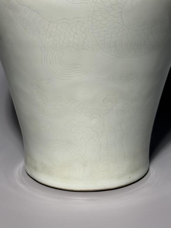 SEAVIEW AUCTIONS PTY LTDA White Porcelain Meiping Vase with Incised Dragon and Cloud Patterns, China, 18th century