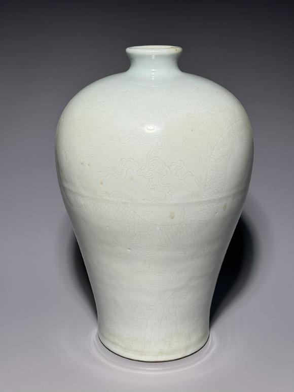 SEAVIEW AUCTIONS PTY LTDA White Porcelain Meiping Vase with Incised Dragon and Cloud Patterns, China, 18th century