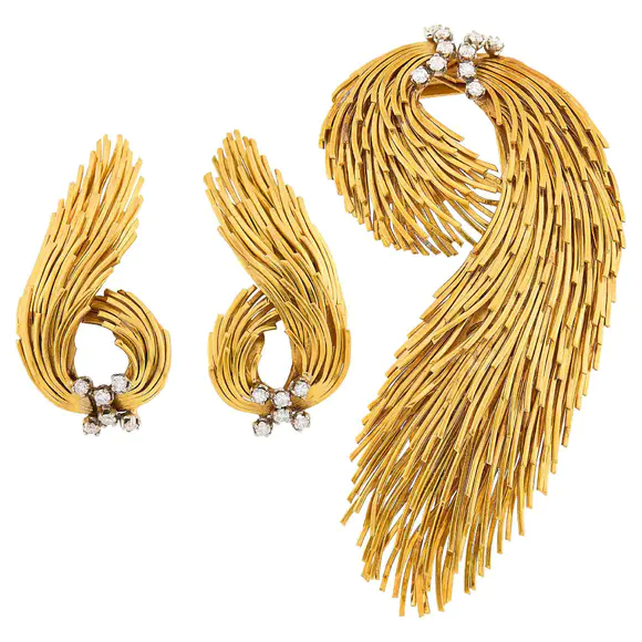 DOYLE Auctioneers & AppraisersGold, Platinum and Diamond Spray Brooch and Pair of Earclips