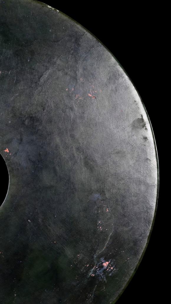 Castle AuctionA Dark Green Jade Bi Disc with Incised Decoration, Neolithic, Circa 3300–2300 C BC Pr.