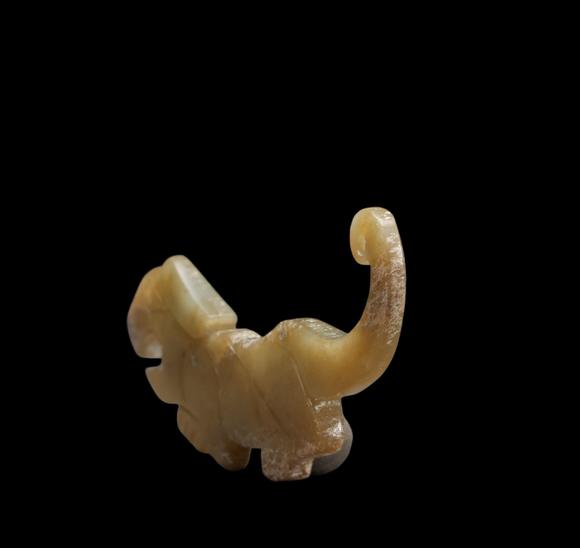 Castle AuctionA Calcified Yellow Jade Tiger-form Pendant, Western Zhou, Circa 10th–9th C BC Pr.
