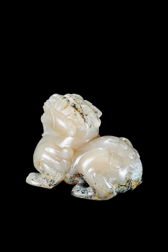 Castle AuctionA Pale Celadon Jade Mythical Beast Carving, Han, Circa 2nd C BC–2nd C AD Pr.