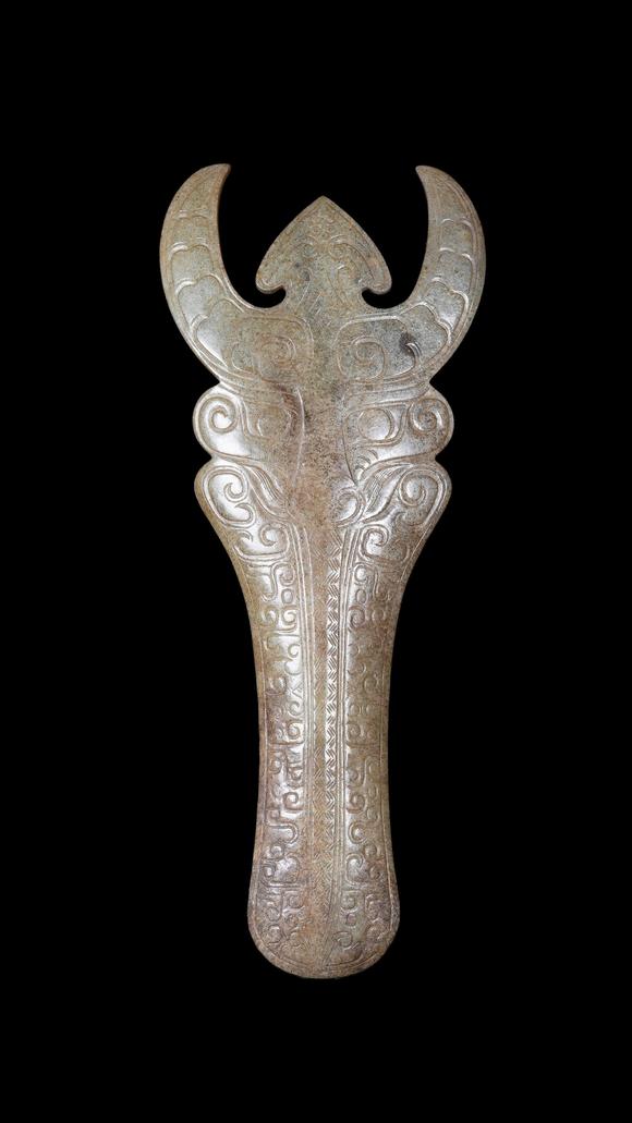 Castle AuctionA Calcified Pale Jade Ox-Headed Plaque, Western Zhou, Circa 10th–9th C BC Pr.