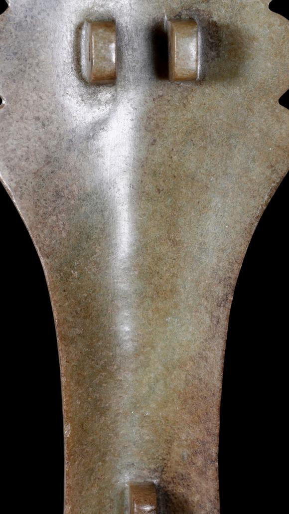 Castle AuctionA Calcified Pale Jade Ox-Headed Plaque, Western Zhou, Circa 10th–9th C BC Pr.