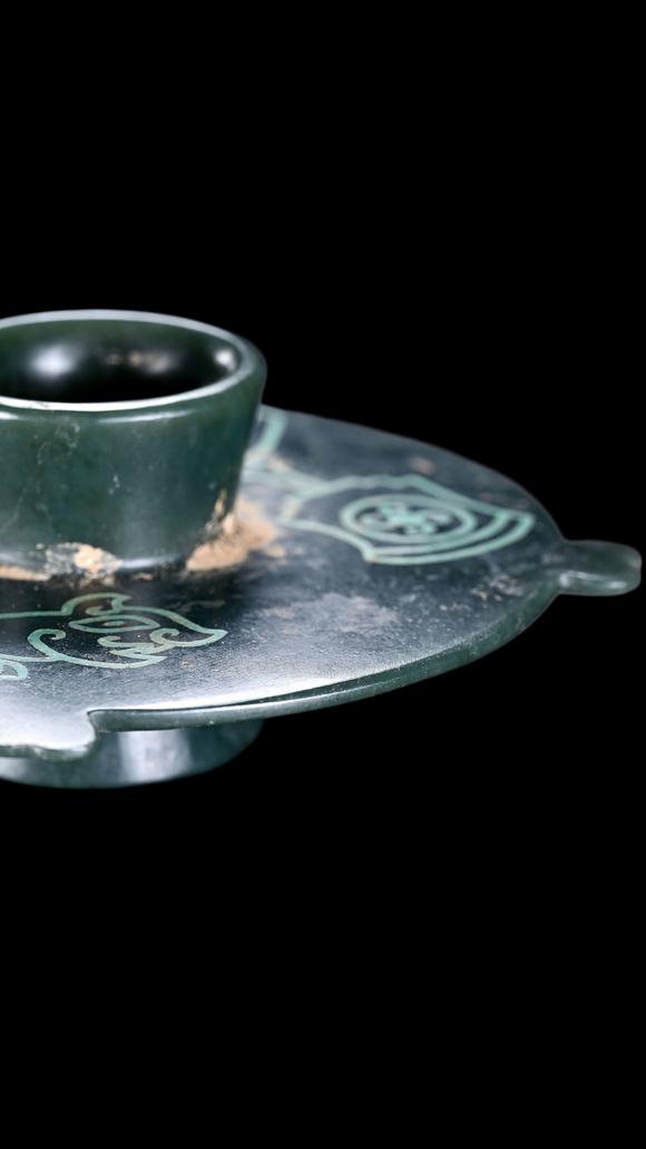 Castle AuctionA Dark Green Jade Stem Cup Stand with Turquoise Inlay, Warring States, Circa 475–221 C BC Pr.
