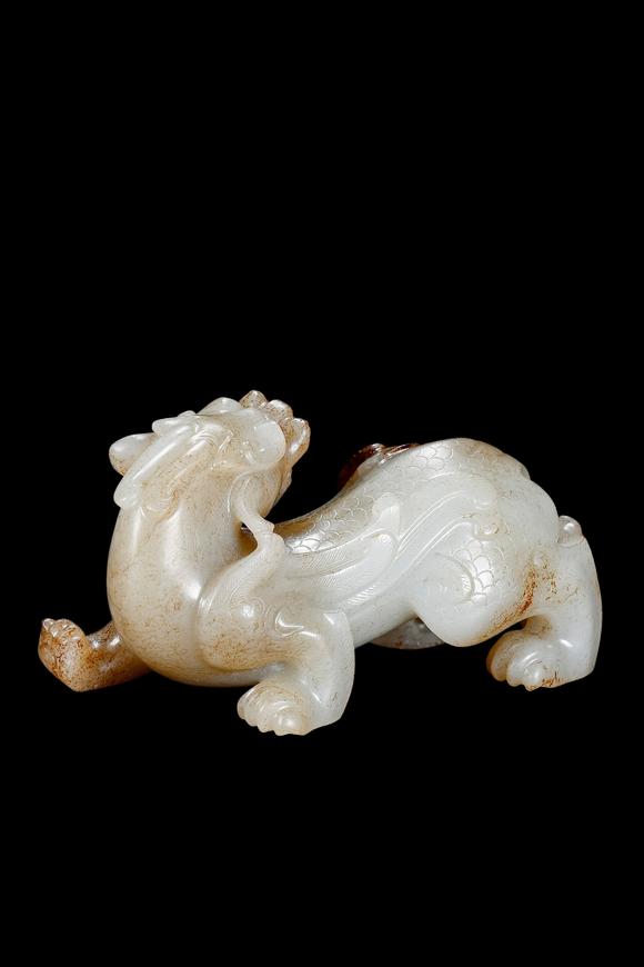 Castle AuctionA White Jade Mythical Beast Carving with Russet Inclusions, Han, Circa 2nd C BC–2nd C AD Pr.