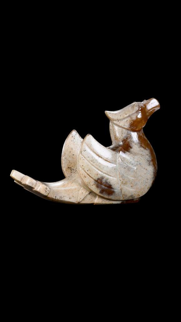 Castle AuctionA Calcified White Jade Phoenix Carving with Russet Inclusions, Han, Circa 2nd C BC–2nd C AD Pr.