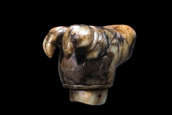 Castle AuctionA Mottled Pale Jade Ram Head Cane Finial, Han, Circa 2nd C BC–2nd C AD Pr.