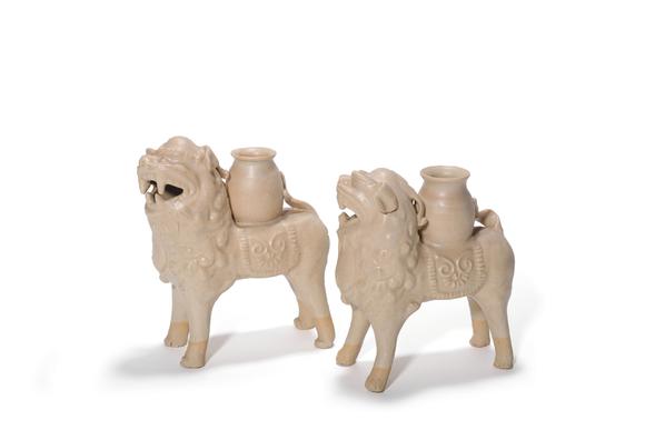 Castle AuctionA Pair of White Porcelain Lion Vase Ornaments, 7th–10th C Pr.