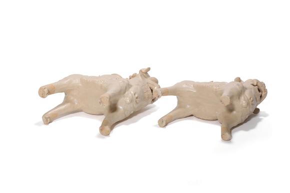 Castle AuctionA Pair of White Porcelain Lion Vase Ornaments, 7th–10th C Pr.