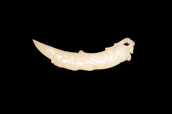 Castle AuctionA Pale Yellow Jade Phoenix Tooth Pendant, Western Zhou, Circa 10th–9th C BC Pr.
