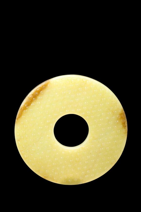 Castle AuctionA Pale Yellow Jade Granule Bi Disc, Warring States, Circa 475–221 BC Pr.