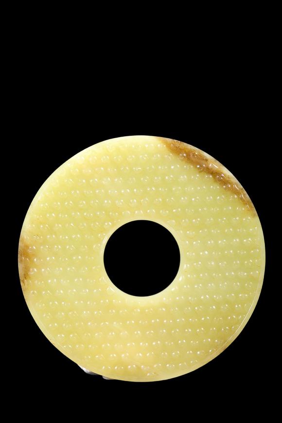 Castle AuctionA Pale Yellow Jade Granule Bi Disc, Warring States, Circa 475–221 BC Pr.