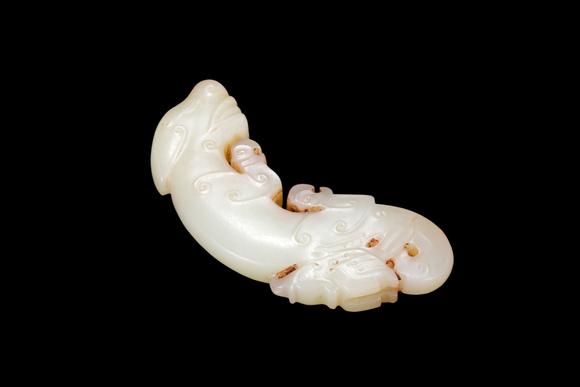 Castle AuctionA Pale Jade C-Shaped Dragon Pendant with Russet Veins, Late Shang, Circa 12th–11th C BC Pr.