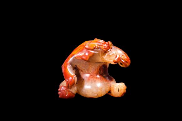 Castle AuctionA Red Agate Crouching Bear Carving, Han, Circa 2nd C BC–2nd C AD Pr.