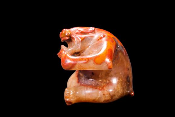Castle AuctionA Red Agate Crouching Bear Carving, Han, Circa 2nd C BC–2nd C AD Pr.