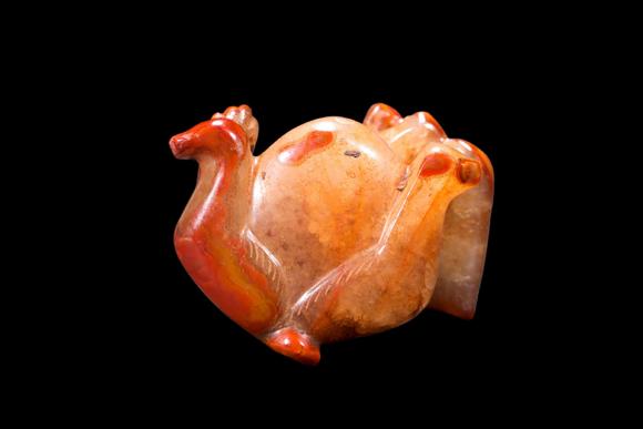 Castle AuctionA Red Agate Crouching Bear Carving, Han, Circa 2nd C BC–2nd C AD Pr.