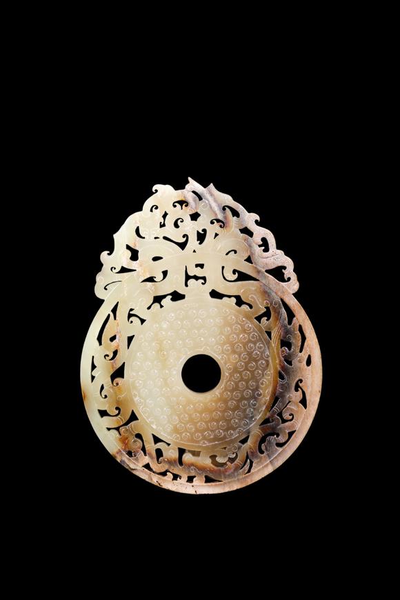 Castle AuctionA Pale Yellow Jade Openwork Dragon Phoenix Bi Disc, Han, Circa 2nd C BC–2nd C AD Pr.