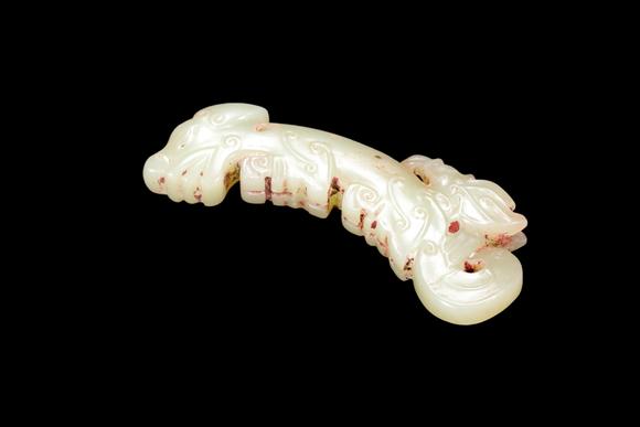 Castle AuctionA Pale Celadon Jade C-Shaped Dragon Pendant, Western Zhou, Circa 10th–9th C BC Pr.