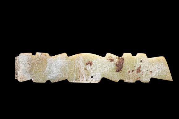 Castle AuctionA Pale Yellow Jade Serrated Dragon Plaque, Western Zhou, Circa 10th–9th C BC Pr.