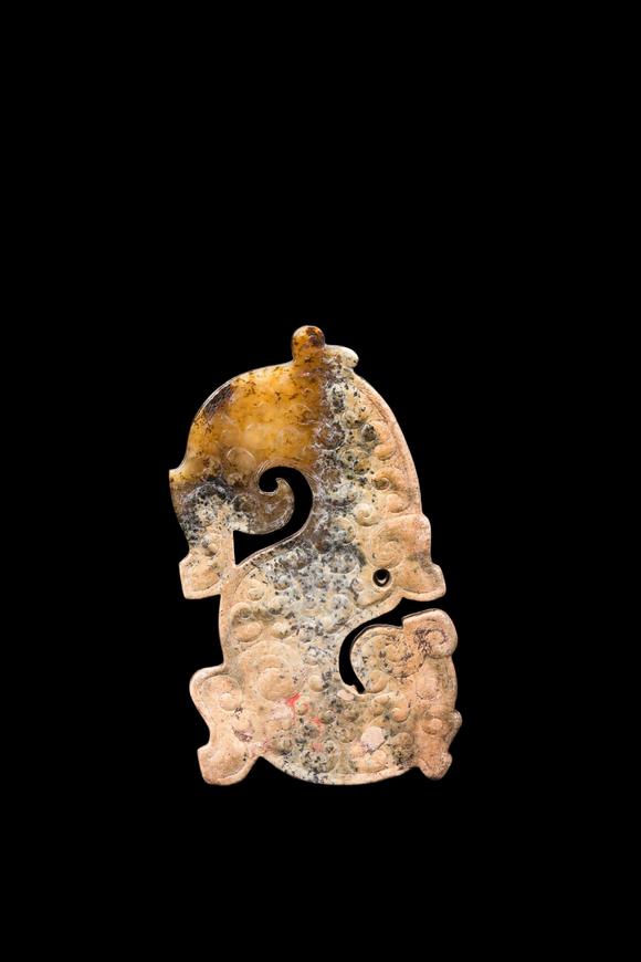 Castle AuctionA Mottled Calcified Jade S-Shaped Dragon Plaque, Spring & Autumn, Circa 8th–5th C BC Pr.
