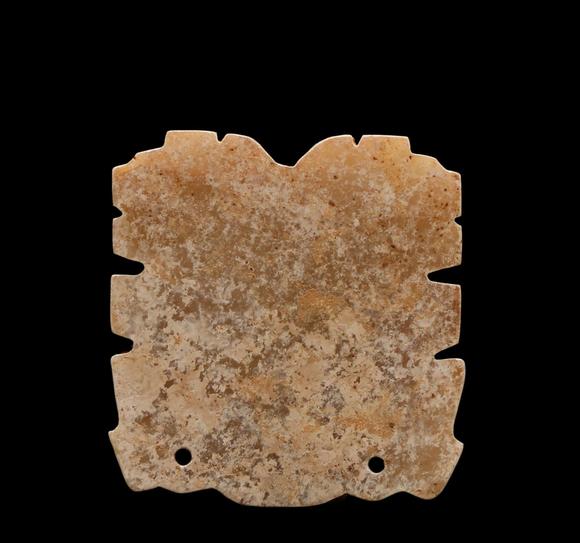 Castle AuctionA Calcified Brown Jade Taotie Mask Pendant, Western Zhou, Circa 10th–9th C BC Pr.
