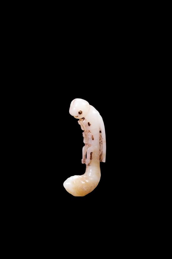 Castle AuctionA White Jade Silkworm Pendant with Russet Veins, Western Zhou, Circa 10th–8th C BC Pr.