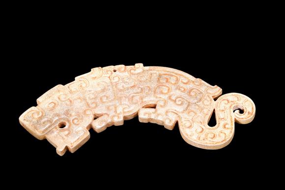 Castle AuctionA Calcified Pale Jade Tiger Plaque, Spring & Autumn, Circa 8th–5th C BC Pr.