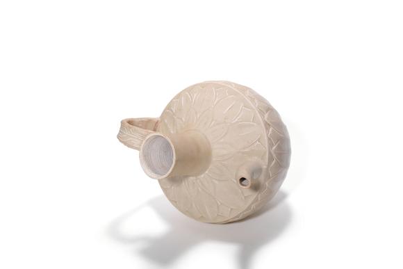 Castle AuctionA White Glaze Carved Lotus Ewer, 10th–12th C Pr.