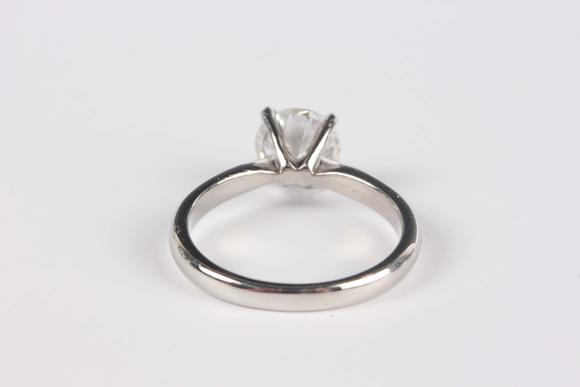 TooveysA platinum and diamond single stone ring, claw set with a circular cut diamond, weight 5.1g, diamond weight approx 1.43ct, ring size approx M, with a