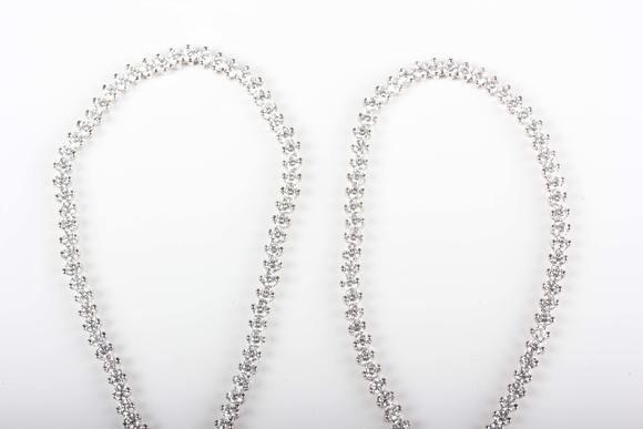 TooveysA white gold and colourless cubic zirconia demi-parure, comprising a graduated necklace and bracelet, each mounted with circular cut colourless cubic