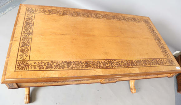 TooveysA Regency bird’s eye maple and foliate inlaid library table, in the manner of Gillows of Lancaster, the moulded top above two frieze drawers, twin su