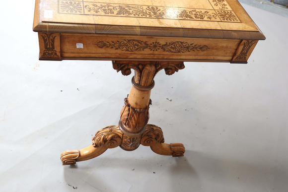 TooveysA Regency bird’s eye maple and foliate inlaid library table, in the manner of Gillows of Lancaster, the moulded top above two frieze drawers, twin su