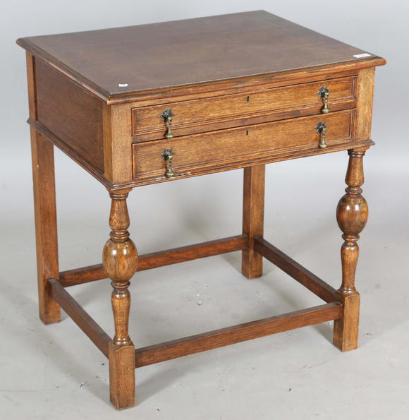 TooveysA George V oak two-drawer side table, height 77cm, width 71cm, depth 56cm.