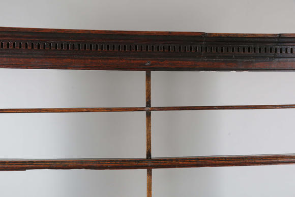 TooveysA good George III North Country oak dresser, the plate rack with pierced side panels above a lappet carved frieze and an arrangement of nine drawers,