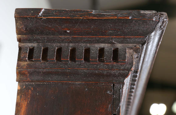 TooveysA good George III North Country oak dresser, the plate rack with pierced side panels above a lappet carved frieze and an arrangement of nine drawers,