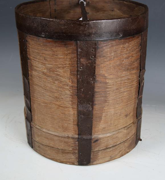 TooveysA 19th century French bentwood and metal bound grain measure, the underside stamped 'CORDIER', height 33cm, diameter 30cm.