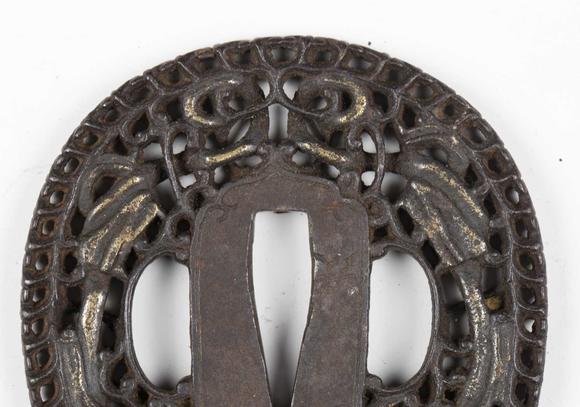 TooveysA fine Japanese oval iron tsuba, Edo period, with intricate