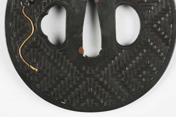 TooveysA very fine Japanese oval shakudo-inlaid bronze tsuba, Edo p