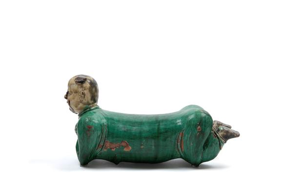 Marcopolo AuctionsPOLYCHROME SANCAI CERAMIC SCULPTURE DEPICTING A RECLINING CHILD, China, late 19th / early 20th century