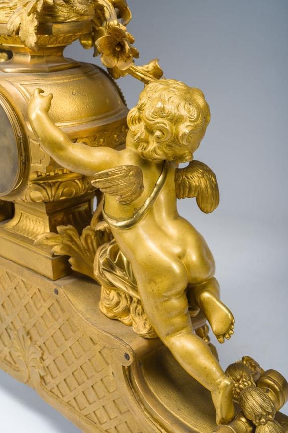Coronari Auctions BVA fine and exceptional French Napoleon III gilt bronze three-piece clock garniture with putti and floral design, 19th C.