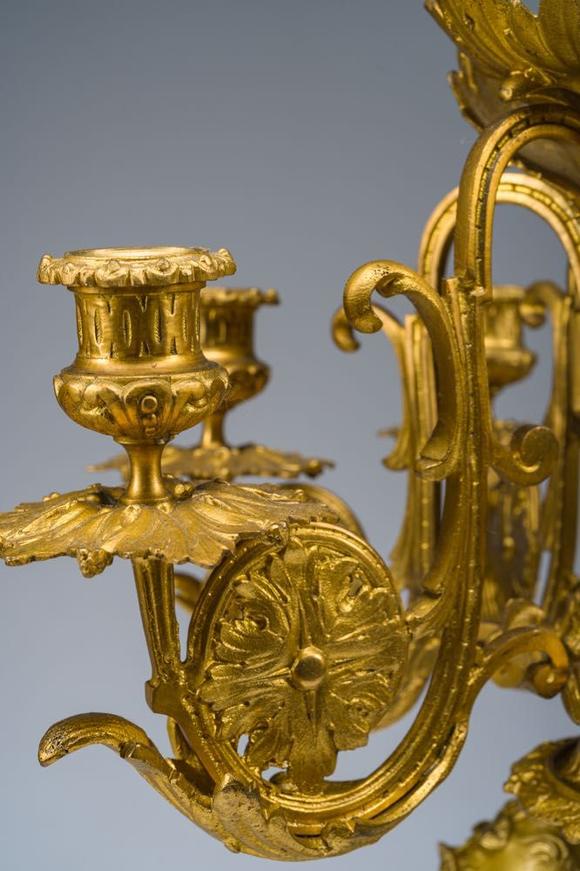 Coronari Auctions BVA fine and exceptional French Napoleon III gilt bronze three-piece clock garniture with putti and floral design, 19th C.