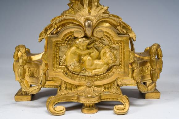 Coronari Auctions BVA fine and exceptional French Napoleon III gilt bronze three-piece clock garniture with putti and floral design, 19th C.