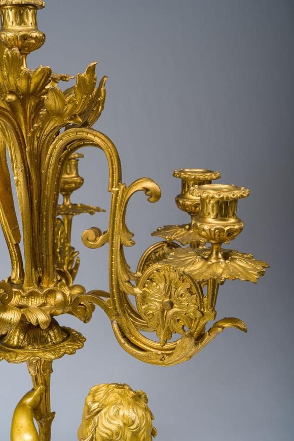 Coronari Auctions BVA fine and exceptional French Napoleon III gilt bronze three-piece clock garniture with putti and floral design, 19th C.