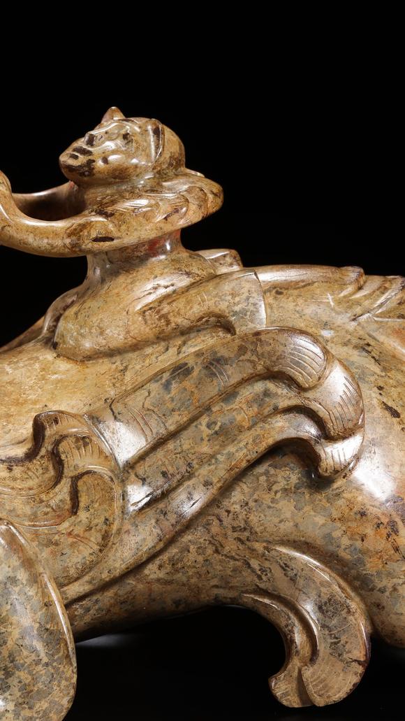 JUBAO HALL AUCTION HOUSE INCPre-Ming Dynasty Feathered Man Taming a Beast
